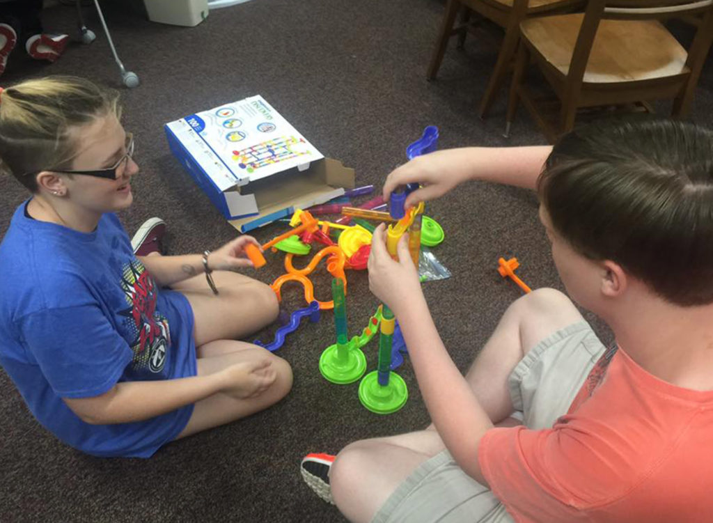 Image of children playing on library floor