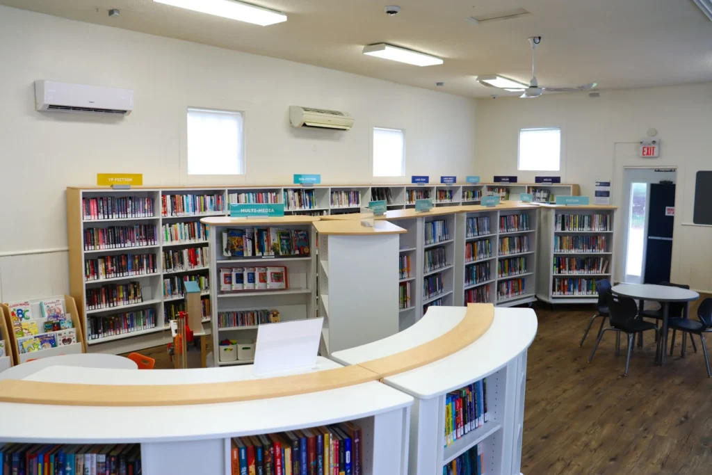 Interior of Port Dalhousie Branch featuring book collections, reading tables, and multimedia section